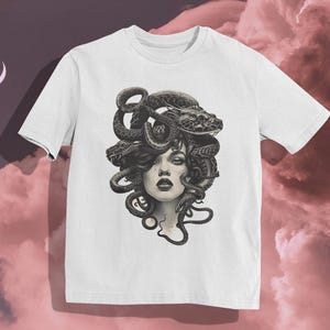 Medusa T-Shirt
Mythical Snake Hair Design
Gothic Fashion Tee
Monochrome Art Shirt
Bold Artistic Clothing
Edgy Mythology Apparel
Snake Graphic T-Shirt
Gothic Streetwear
Powerful Female Art
Unique Mythology Fashion