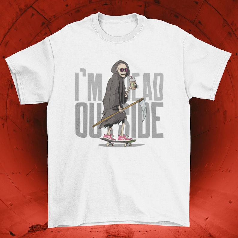 May include: White t-shirt with a cartoon image of the Grim Reaper skateboarding and holding a drink. The text "I'M DEAD OUTSIDE" is printed on the shirt.