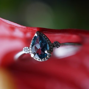 Natural blue simple topaz ring with cubic zirconias, 925 sterling silver