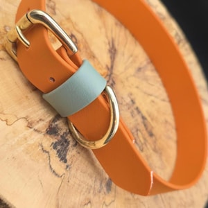 May include: A white ceramic mug with a black handle and the text "But First, Coffee" in a bold, black font. The mug is set against a neutral background, highlighting its simple design.