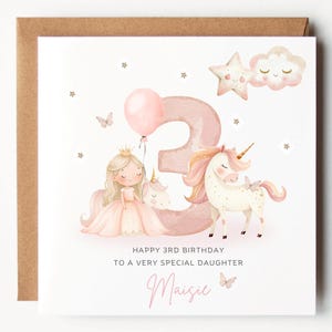 May include: A birthday card featuring a princess, unicorn, and the number 3. The card includes a pink balloon, stars, and clouds. Text reads "Happy 3rd Birthday to a very special daughter" and a name.