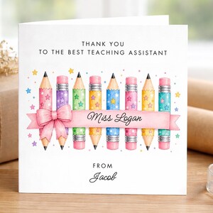 May include: A white card with the message "THANK YOU TO THE BEST TEACHING ASSISTANT" and a pink banner reading "Miss Logan". The design includes colourful pencils and stars, with "Jacob" at the bottom.