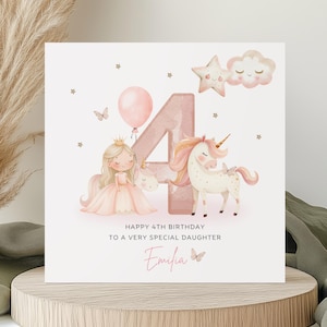 May include: A square birthday card with a princess and unicorn theme. The card features a large number 4, a princess, a unicorn, a balloon, and the text "Happy 4th Birthday To a Very Special Daughter". The daughter's name, Emilia, is also on the card.