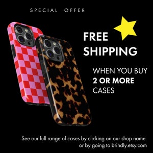 two iphone cases with a black background and a red and white checkerboard pattern
