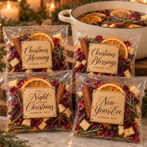 May include: Four clear plastic pouches containing dried orange slices, cinnamon sticks, star anise, cranberries, and rosemary. Each pouch features a square kraft paper label with text: Christmas Morning, Christmas Blessings, The Night Before Christmas, and New Years Eve.