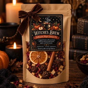 May include: A brown paper pouch containing a dried potpourri blend of orange slices, cinnamon sticks, and star anise. The label reads Witches Brew, Halloween Magic Simmer Pot, with illustrations of a cauldron, pumpkins, and autumn leaves.