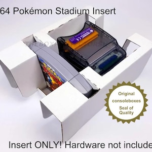 May include: White cardboard insert for N64 Pokémon Stadium game cartridges. The insert holds a game cartridge and a clear plastic case. Text on the insert reads "Insert ONLY! Hardware not included."