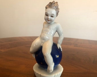 Rosenthal putto on a star ball, porcelain, signed F. Nagy, brand around 1926