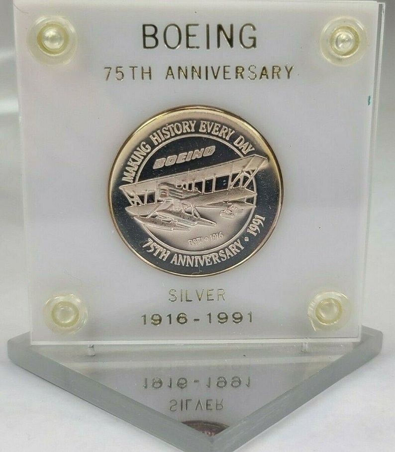 1991 Boeing 75th Anniversary 1.5 OZ .999 silver round in white a 1991 Boeing 75th Anniversary 1.5 OZ .999 silver round in white a