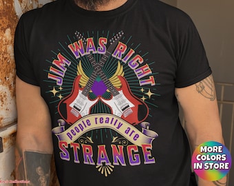 May include: Black t-shirt with a graphic design of two crossed electric guitars with the text "Jim Was Right People Really Are Strange" in a colorful font.