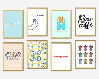 May include: Nine framed prints with Italian-themed designs. The prints feature phrases like "la dolce vita", "ma che va?", "Ciao bella", "Buongiorno", and "ma prima un caffe". Other prints feature a hand gesture, a glass of orange juice, a tiled pattern, and a set of colorful coffee pots.