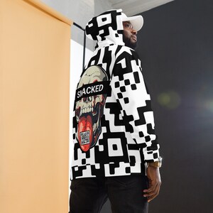 May include: Black and white hoodie with a skull graphic and the word "SNACKED" printed across the skull. The hoodie has a QR code on the skull's tongue.
