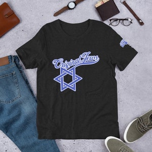 May include: A dark heather grey t-shirt with a blue star of David and the text "Original Jews" in a blue cursive font.