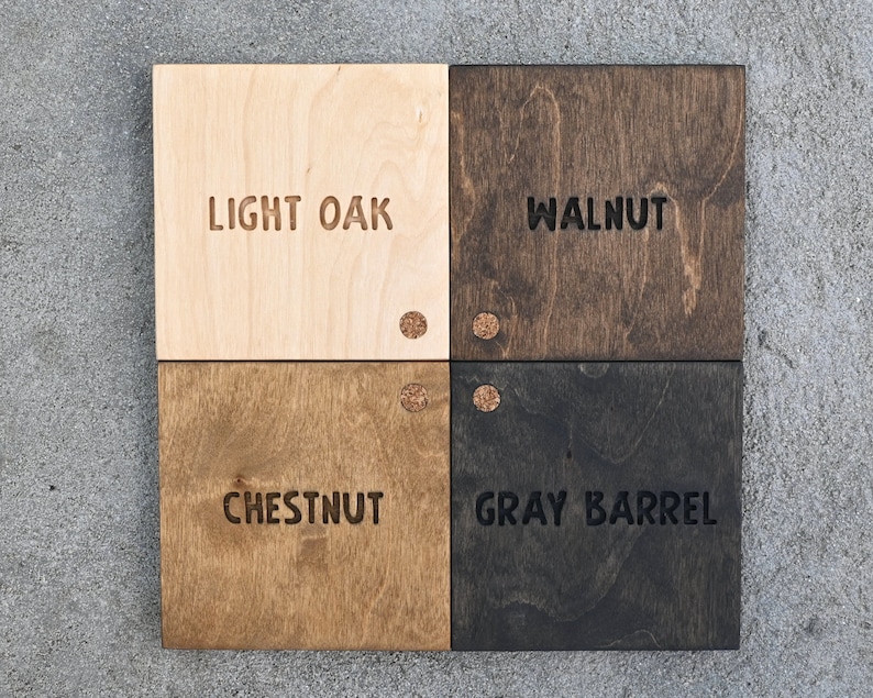 May include: Four wood samples with different stain colours: Light Oak, Walnut, Chestnut, and Grey Barrel. Each sample has a small cork circle in the top right corner.