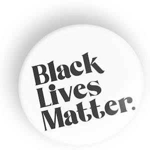 May include: White button with the text "Black Lives Matter" in black.