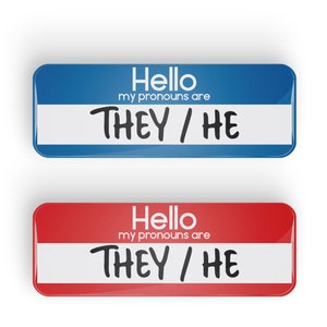 May include: Two name tags, one blue and one red, with the text "Hello my pronouns are THEY / HE" on each.