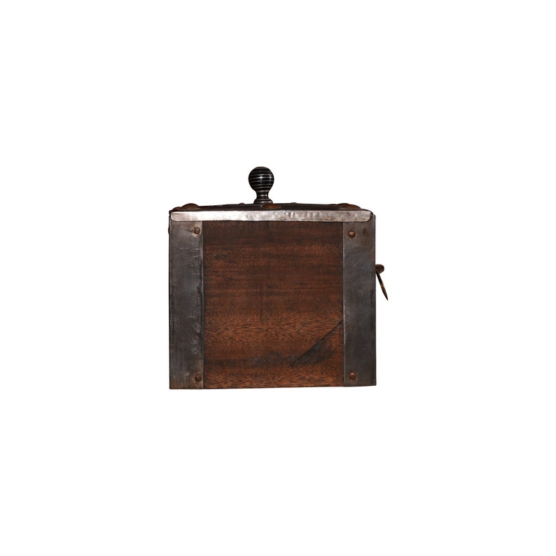 May include: A wooden box with metal trim and a black knob on the lid. The box is closed.