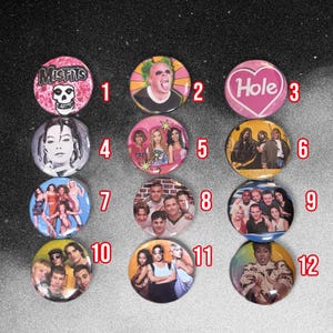 May include: A collection of twelve circular pin-back badges arranged in a grid, each featuring distinct graphic designs including band logos, musical artist portraits, and group photographs, labelled with red numbers one through twelve.
