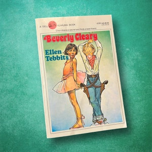 May include: A Dell Yearling Book cover featuring an illustration of two children, a girl in a pink dress and a boy in blue jeans, with the title "Beverly Cleary" and the book's title "Ellen Tebbits" in large, bold font.