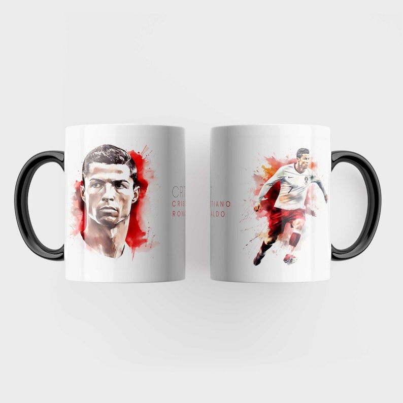 May include: White ceramic mug with a black handle. The mug features a watercolour illustration of Cristiano Ronaldo, a famous football player. The text "Cristiano Ronaldo" is printed on the mug.