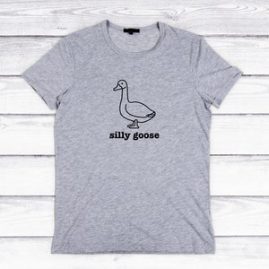 May include: A gray t-shirt with a black line drawing of a goose and the text "silly goose" printed on the front.