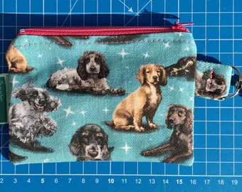 Handmade zipped pouch: Cocker Spaniels on teal background