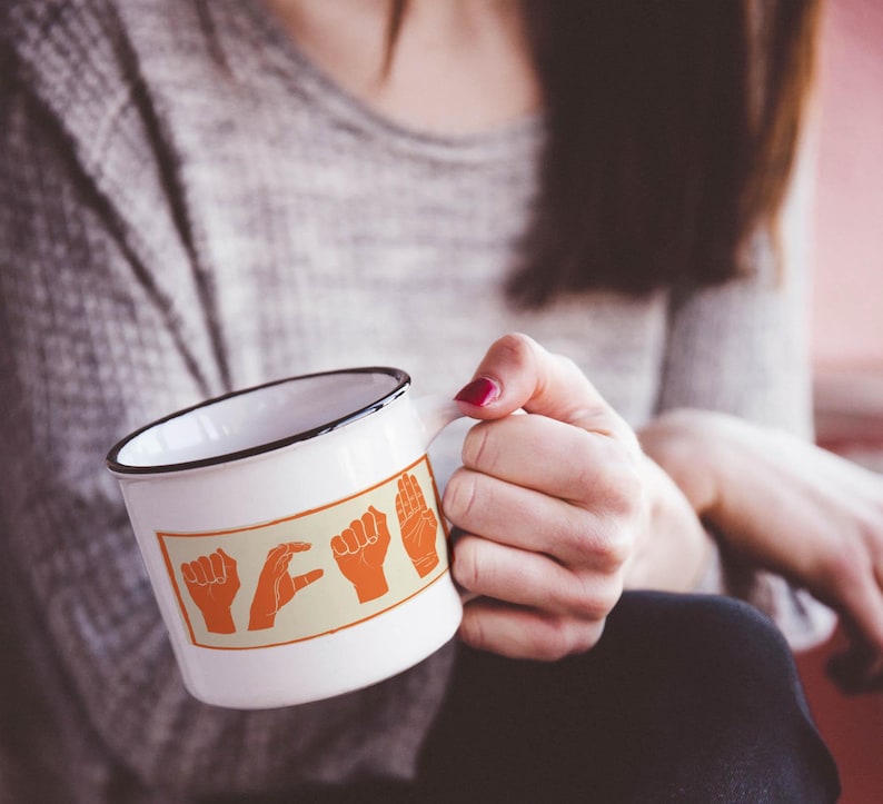 ACAB hand signs sticker on white mug – activism design made with care and empathy.