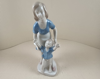 Vintage porcelain mother with child figurine made in Germany