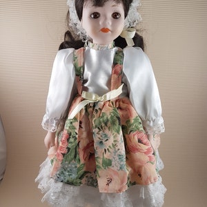 Vintage Porcelain Bisque Doll: Collectible Floral Dress Doll (16.5 inches)