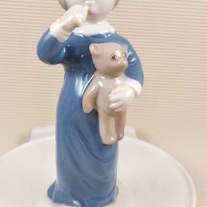 Vintage porcelain figurine girl with teddy bear Germany