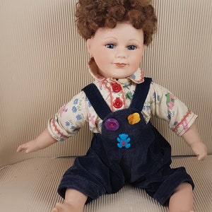 Vintage bisque porcelain doll sitting collectible medium size