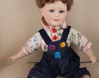 Vintage bisque porcelain doll sitting collectible medium size
