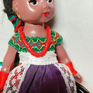 Vintage mini folklore ethnic black plastic doll collectible