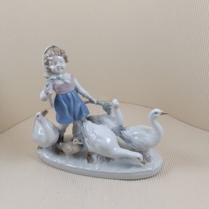 Vintage girl with geese big porcelain figurine made in mid century in east Germany