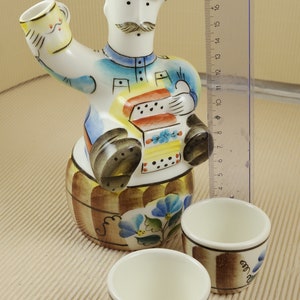 Vintage russian porcelain bottle with two cups