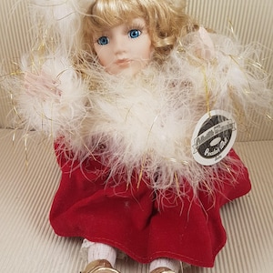 Vintage bisque porcelain doll music box collectible medium size blond curly hair red dressed