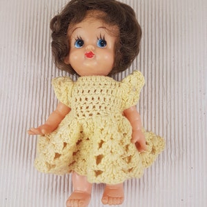 Small vintage plastic girl doll