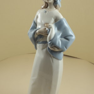 Vintage porcelain figurine girl with goose spain