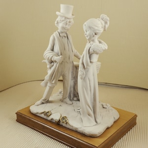 Vintage Capodimonte  G.Armani signed boy and girl figurine on wooden stand