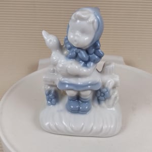 Vintage little baby girl with goose and figurine porcelain