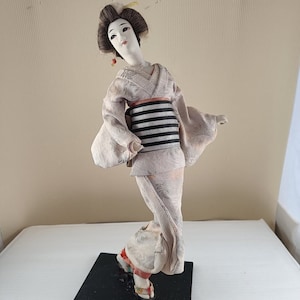 Antique japan geisha textile doll on wooden stand