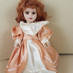 Vintage lovely small porcelain doll red hair collectible