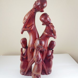 Wood carving sculpture African family playing flute music one piece