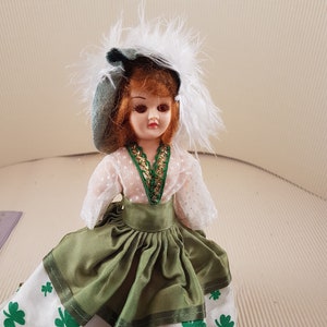Small vintage old plastic girl doll victorian dressed