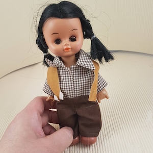 Small vintage plastic girl doll
