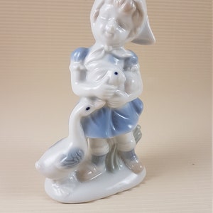 Vintage little baby girl with goose and rabbit figurine porcelain