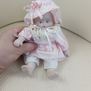 Lovely porcelain doll pink dressed oldfashion