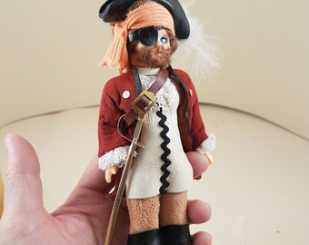 Small vintage plastic pirate doll