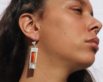 handcrafted from artisans in Agadez ALAM silver and red glass earrings engraved with geometric and cultural motif of tuareg culture and art