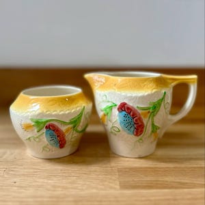 AVON WARE Vintage l Milk Jug / Creamers & Sugar Bowl l Stylized flowers in shades of blue, red, and green, with yellow accents l Bone China